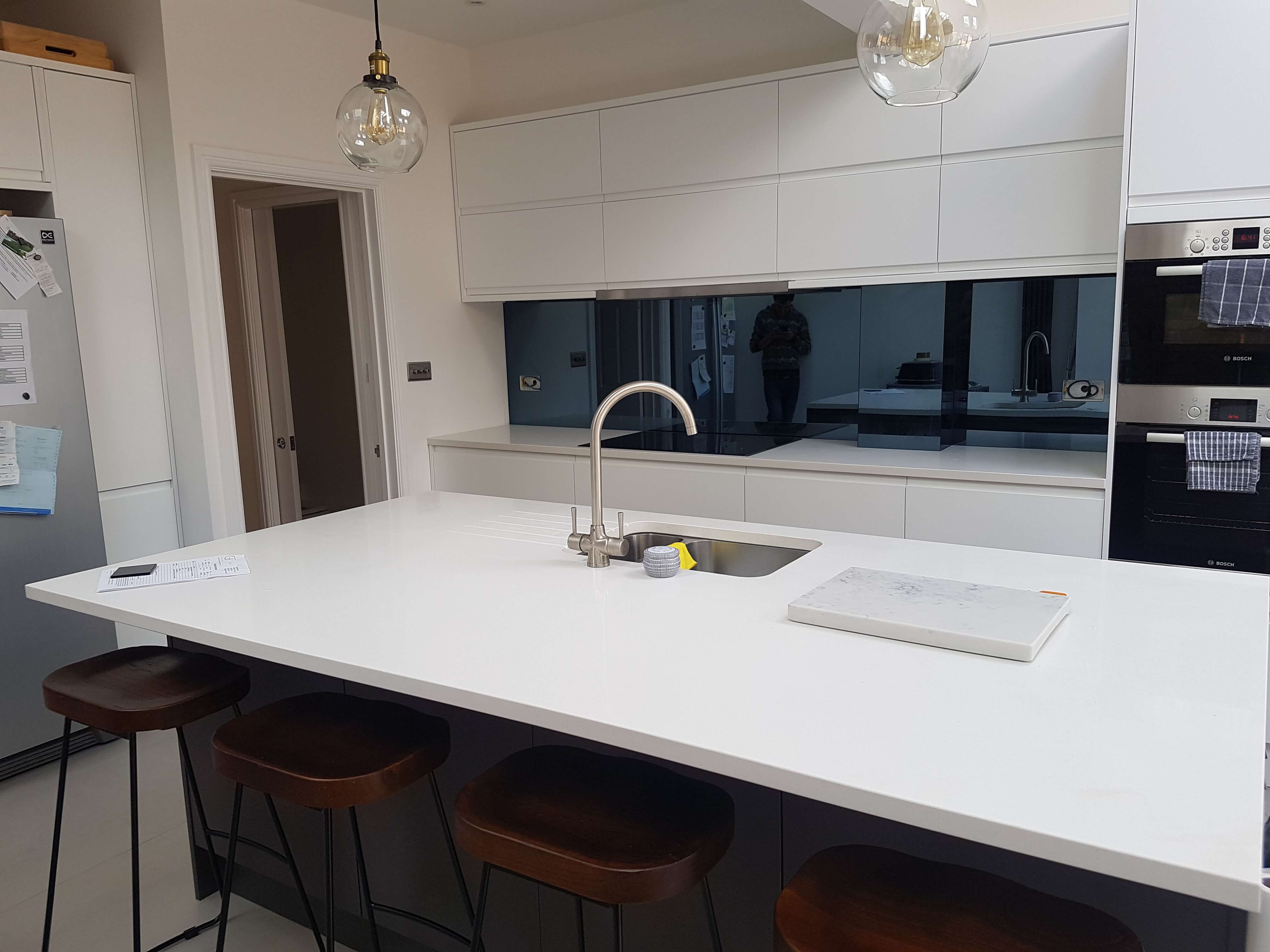 Branco Cenzento Quartz worktop and Grey mirror splashback